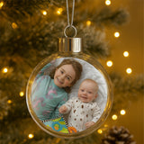 Personalised photo Christmas bauble with a children's photo hanging on a Christmas tree